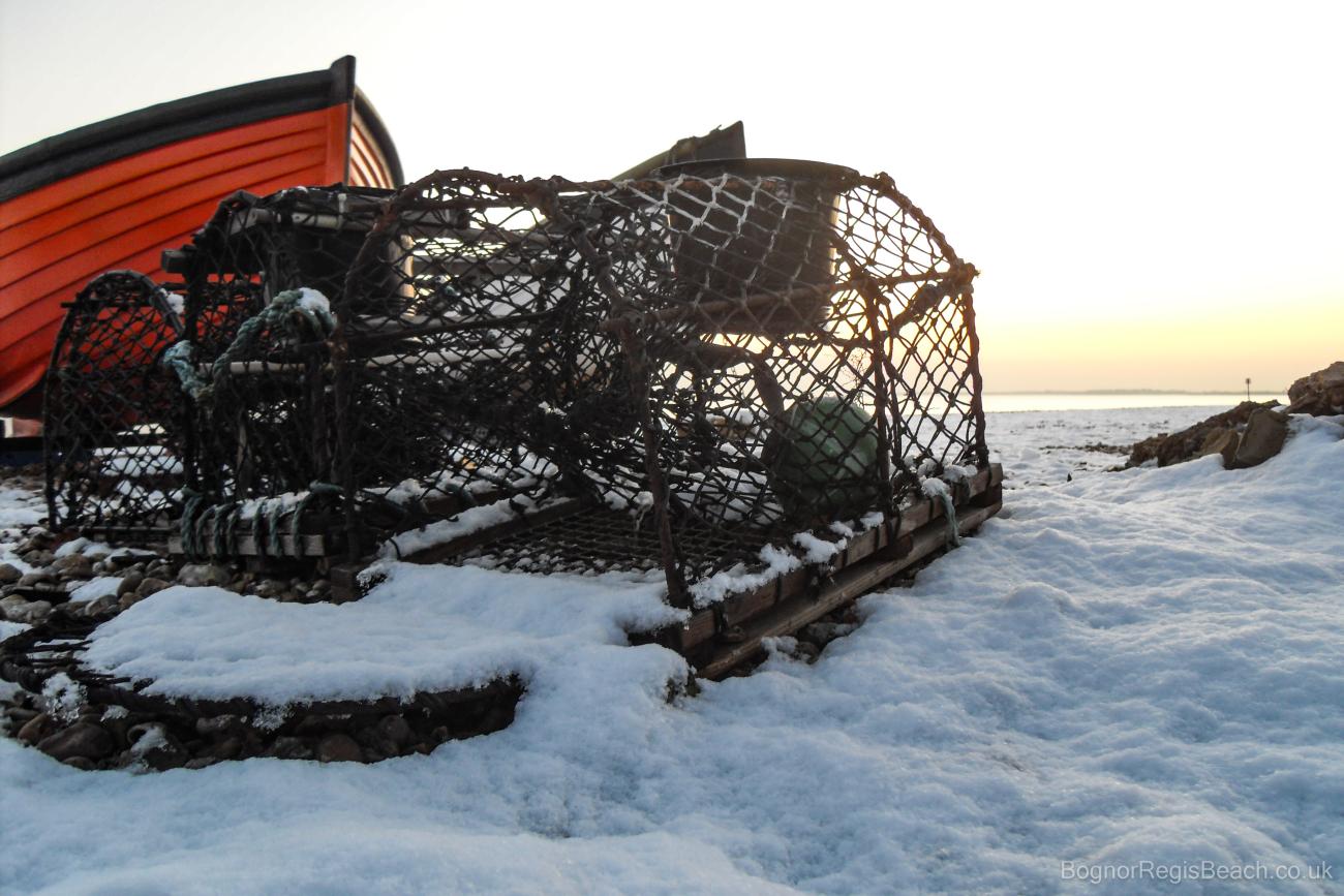 Fishing lobster pots in the snow at Bognor Regis