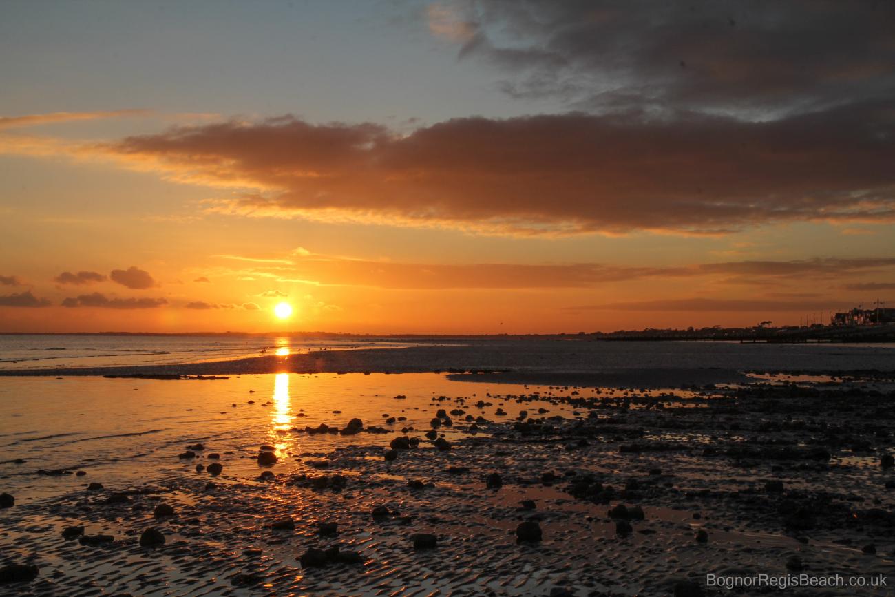 Sunset with wet sand west beach Bognor Regis
