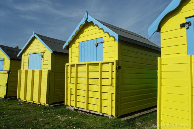 Yellow beach huts at Felpham beach