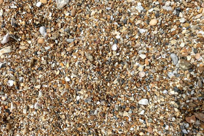 Close up of small pebbles on the beach
